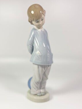 Lladro Porcelain Figurine: Boy w/beach ball #4899 "Punishment" - retired in 1983